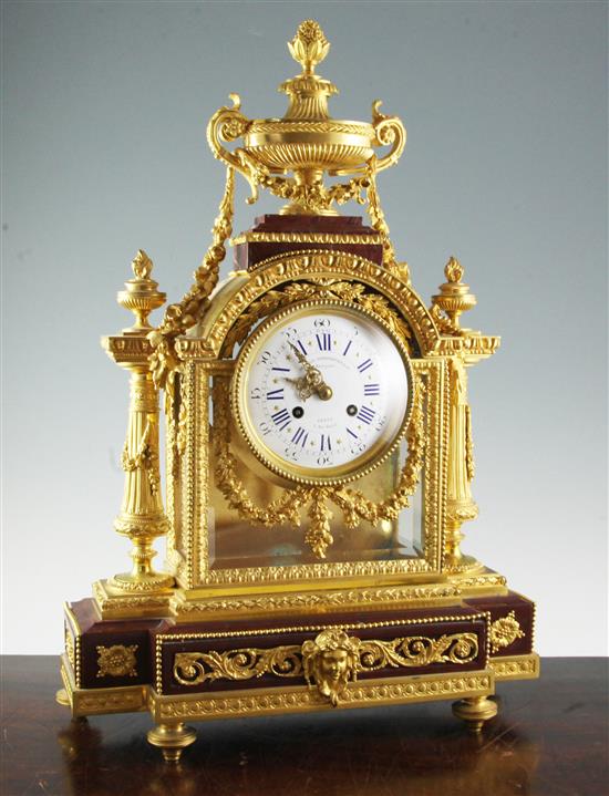 Le Merle Charpentier & Cie. A handsome late 19th century French ormolu and rouge marble mantel clock, 23in.